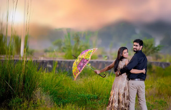 a man and a woman standing in a field