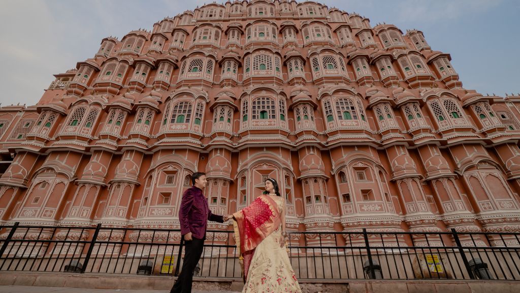 Couple posing in front of the iconic Hawa Mahal in Jaipur during their pre-wedding shoot.