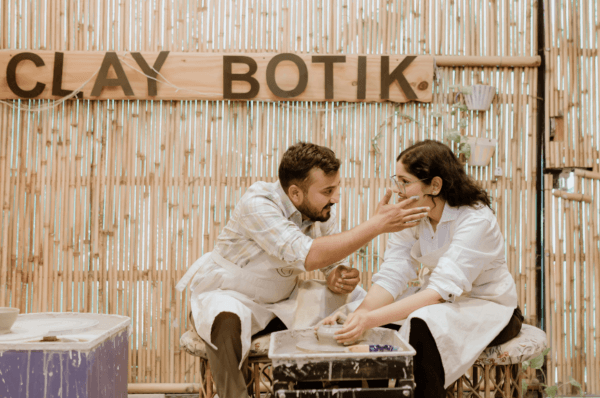 A couple creating handmade pottery together, a unique concept for Pre Wedding Shoot Locations in Jaipur at Clay Botik studio