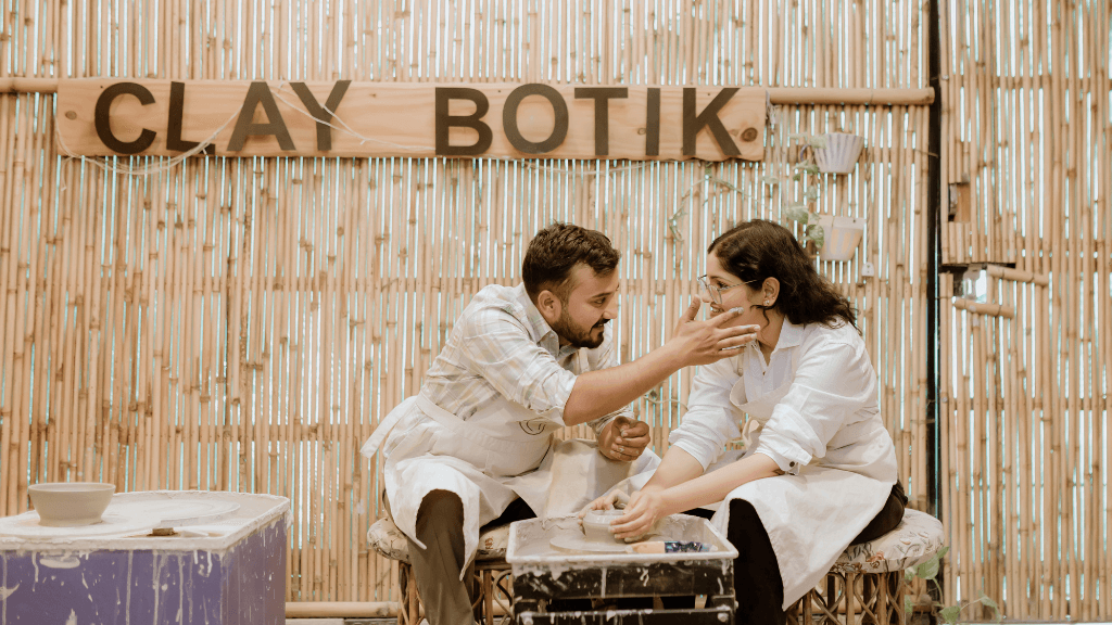 Couple enjoying a pottery-making activity during their pre-wedding photoshoot 