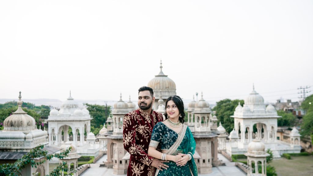 Pre-Wedding Shoot Locations in JaipurA couple dressed in traditional Indian attire posing romantically in front of the stunning architectural backdrop of Jaipur’s heritage monuments during their pre-wedding photoshoot.