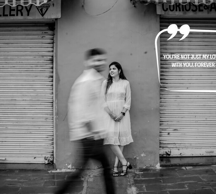 A black and white image of a woman standing by a closed shop shutter while her partner walks past in motion blur, overlaid with the quote: “You’re not just my love, you’re my peace. With you, forever feels too short.” — perfect for couple quotes for wedding content.