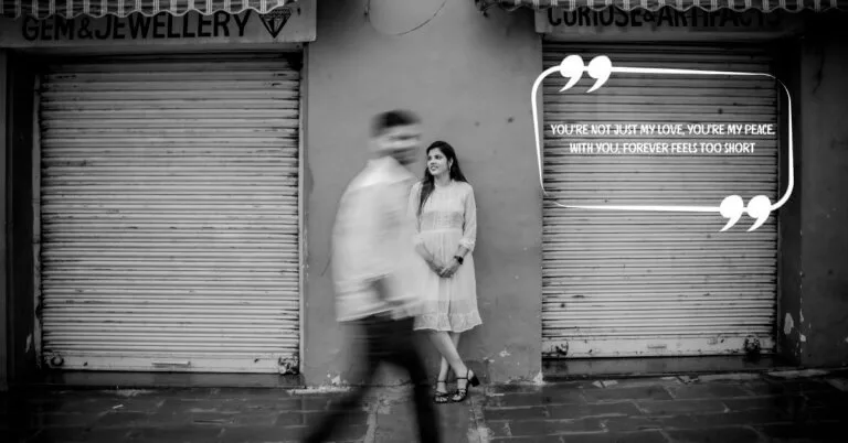 A black and white image of a woman standing by a closed shop shutter while her partner walks past in motion blur, overlaid with the quote: “You’re not just my love, you’re my peace. With you, forever feels too short.” — perfect for couple quotes for wedding content.